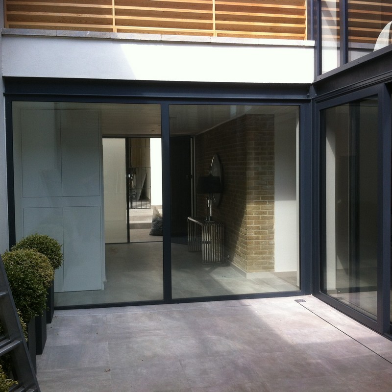 Floor-to-ceiling sliding doors opening to courtyard in East Dulwich